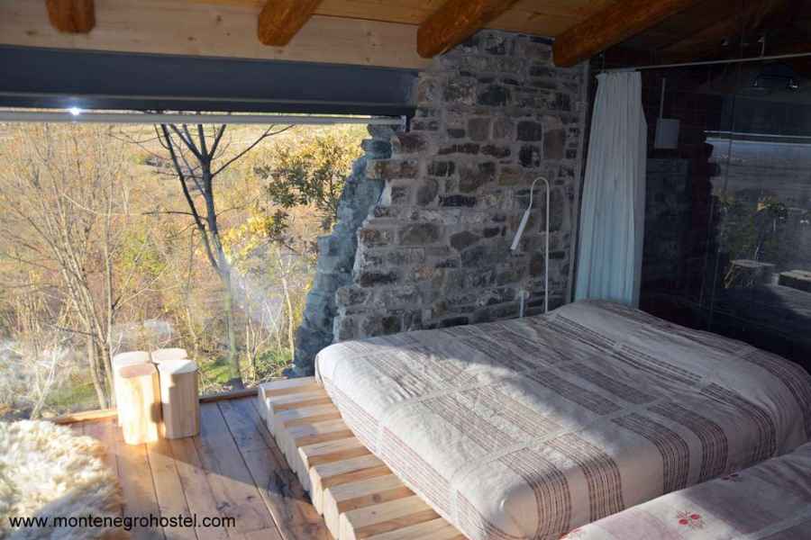 Double bedroom with the glass wall